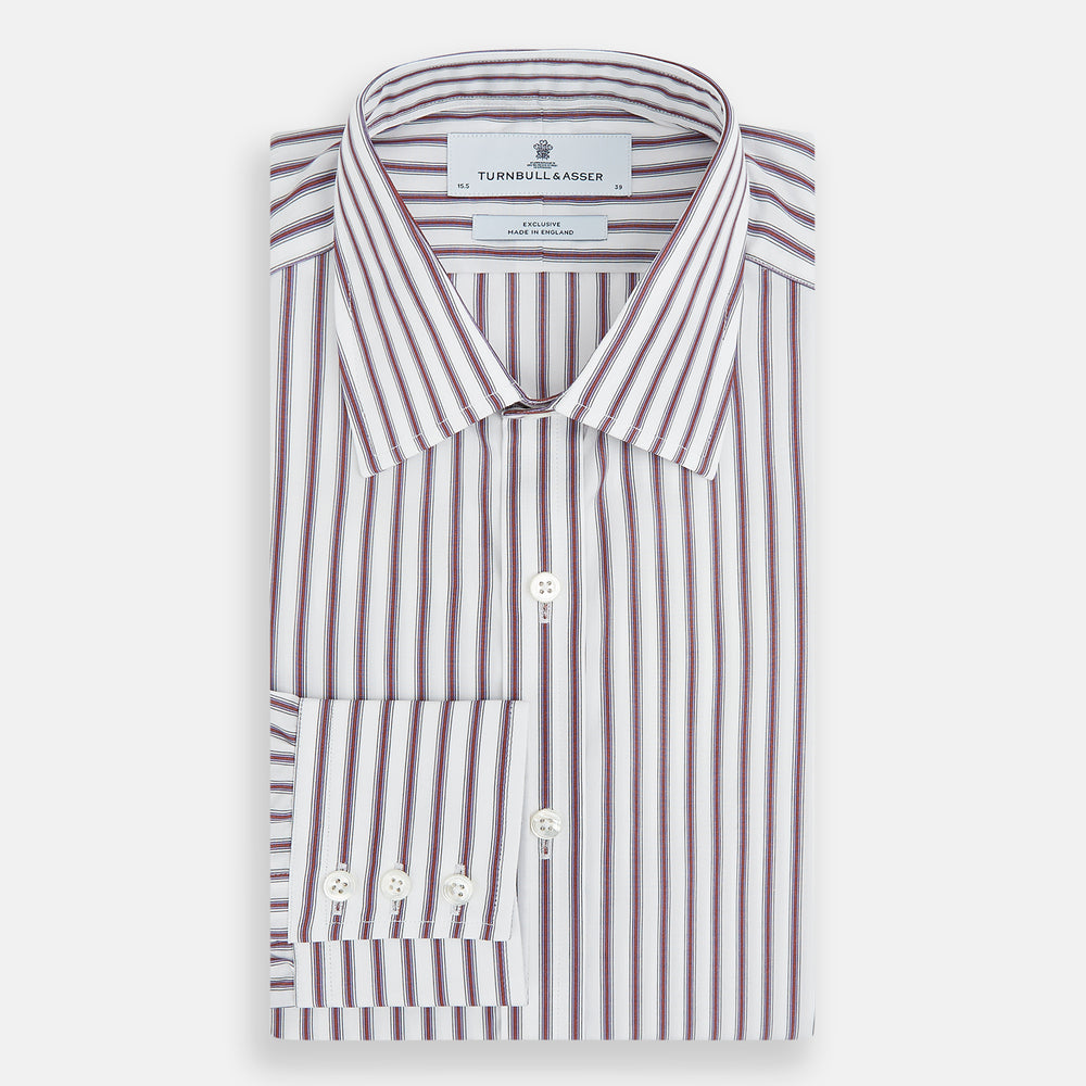 The Turnbull & Asser Burgundy Track Stripe Winston Shirt features long sleeves, classic collar, buttoned cuffs, and vertical white and dark maroon stripes—perfect for formal wear and shown laid flat against a white background.