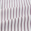 View 6 of product The Turnbull & Asser Burgundy Track Stripe Winston Shirt features long sleeves, classic collar, buttoned cuffs, and vertical white and dark maroon stripes—perfect for formal wear and shown laid flat against a white background.