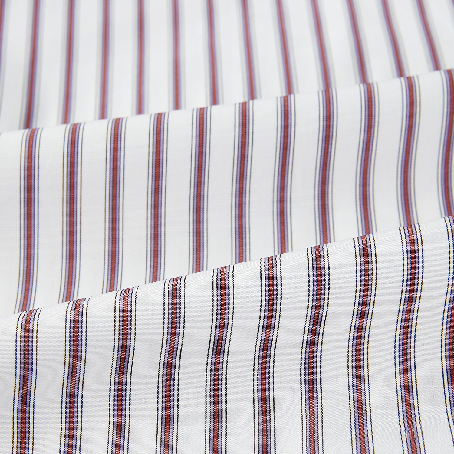 View 6 of product The Turnbull & Asser Burgundy Track Stripe Winston Shirt features long sleeves, classic collar, buttoned cuffs, and vertical white and dark maroon stripes—perfect for formal wear and shown laid flat against a white background.