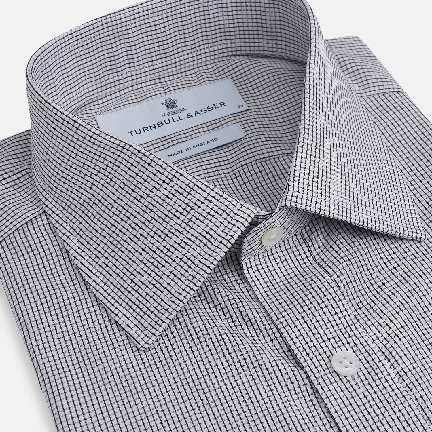 View 2 of product The Turnbull & Asser Dark Blue and White Graph Check Mayfair Shirt is a long-sleeve, button-up shirt with a pointed collar, shown on a plain white background.