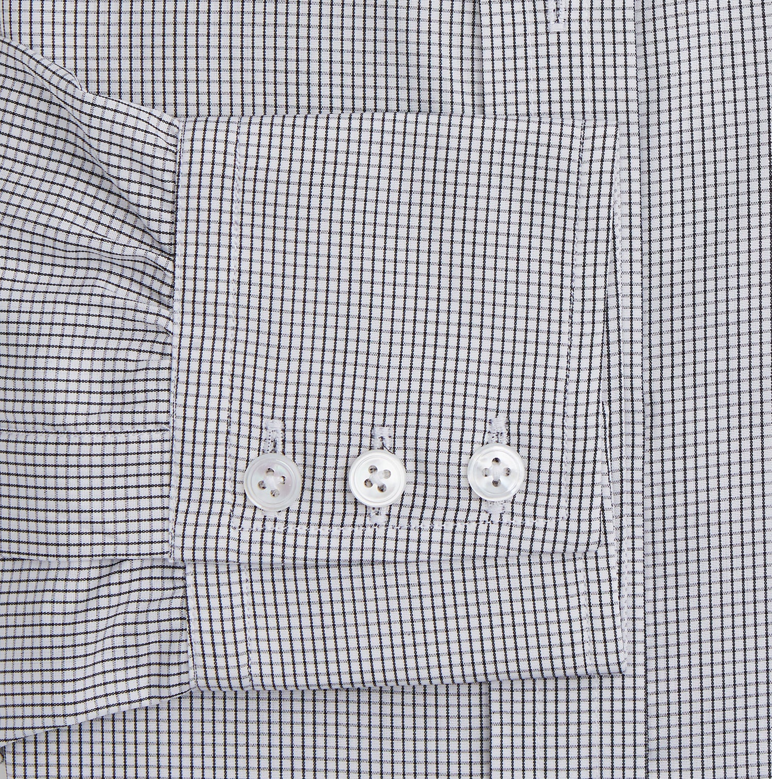 View 3 of product The Turnbull & Asser Dark Blue and White Graph Check Mayfair Shirt is a long-sleeve, button-up shirt with a pointed collar, shown on a plain white background.