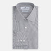 View 4 of product The Turnbull & Asser Dark Blue and White Graph Check Mayfair Shirt is a long-sleeve, button-up shirt with a pointed collar, shown on a plain white background.
