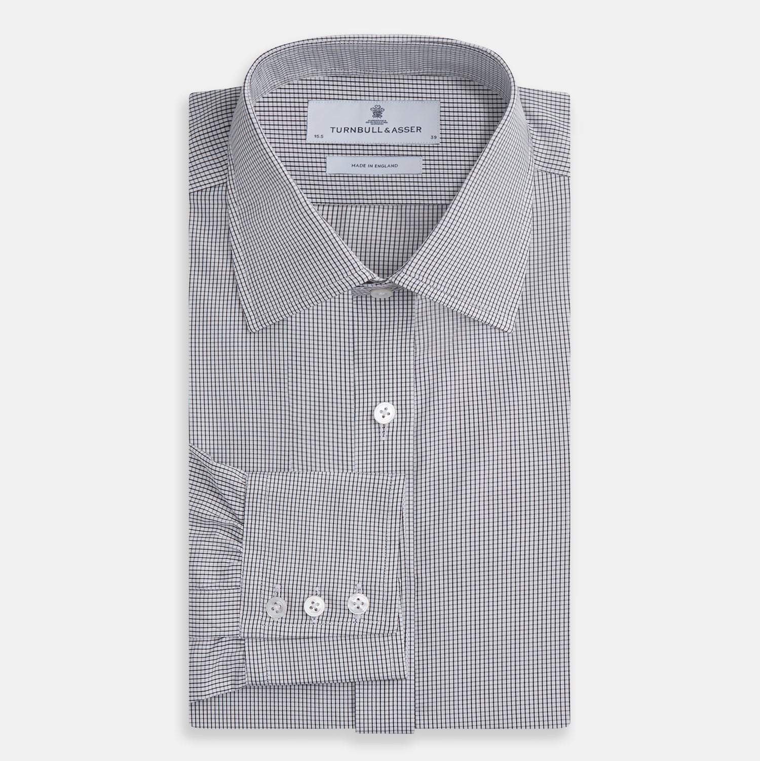 View 4 of product The Turnbull & Asser Dark Blue and White Graph Check Mayfair Shirt is a long-sleeve, button-up shirt with a pointed collar, shown on a plain white background.