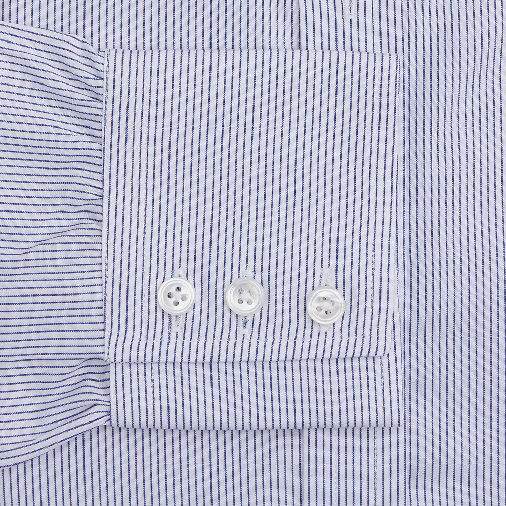 The Turnbull & Asser Blue Pinstripe Mayfair Shirt is a cotton poplin, long-sleeve button-down with a classic collar and white buttons, shown laid flat on a white background.