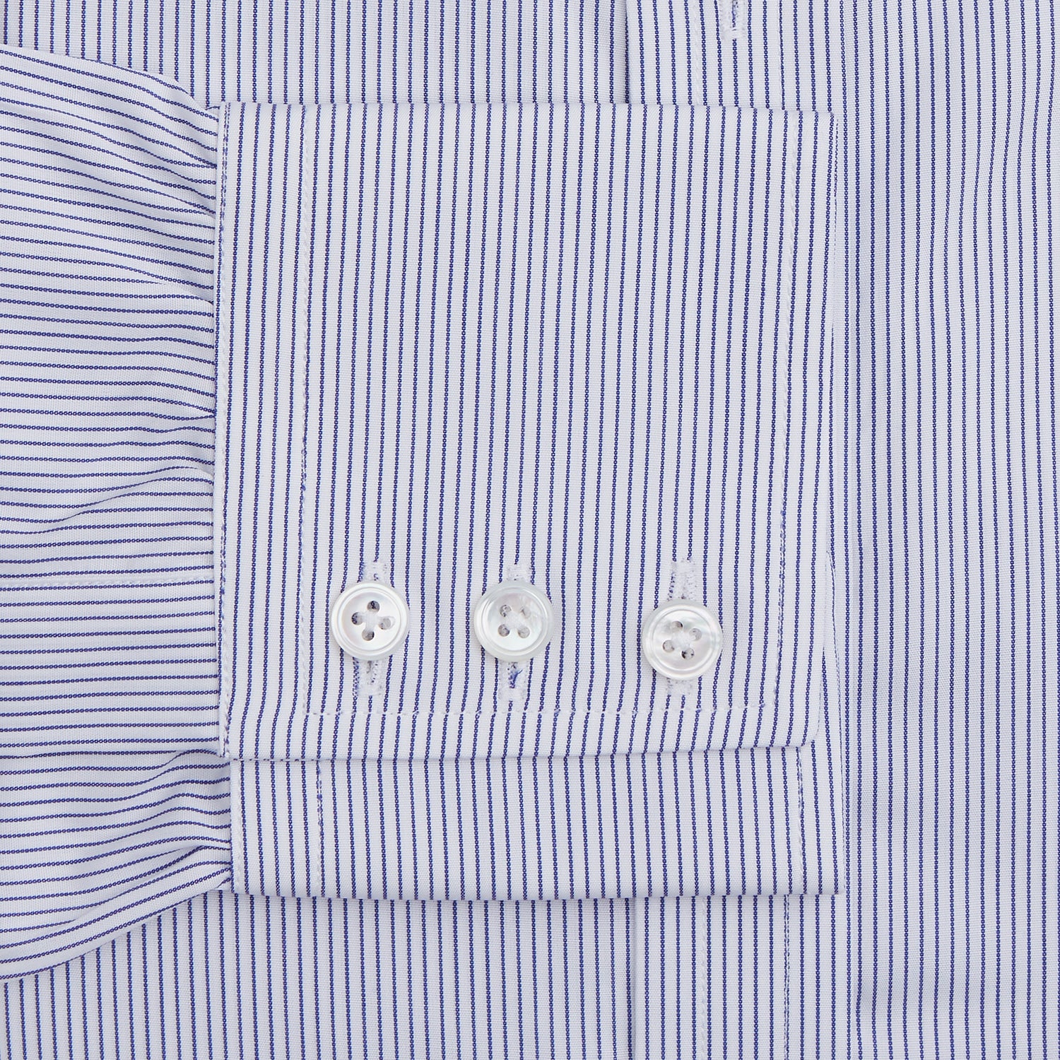 View 3 of product The Turnbull & Asser Blue Pinstripe Mayfair Shirt is a cotton poplin, long-sleeve button-down with a classic collar and white buttons, shown laid flat on a white background.