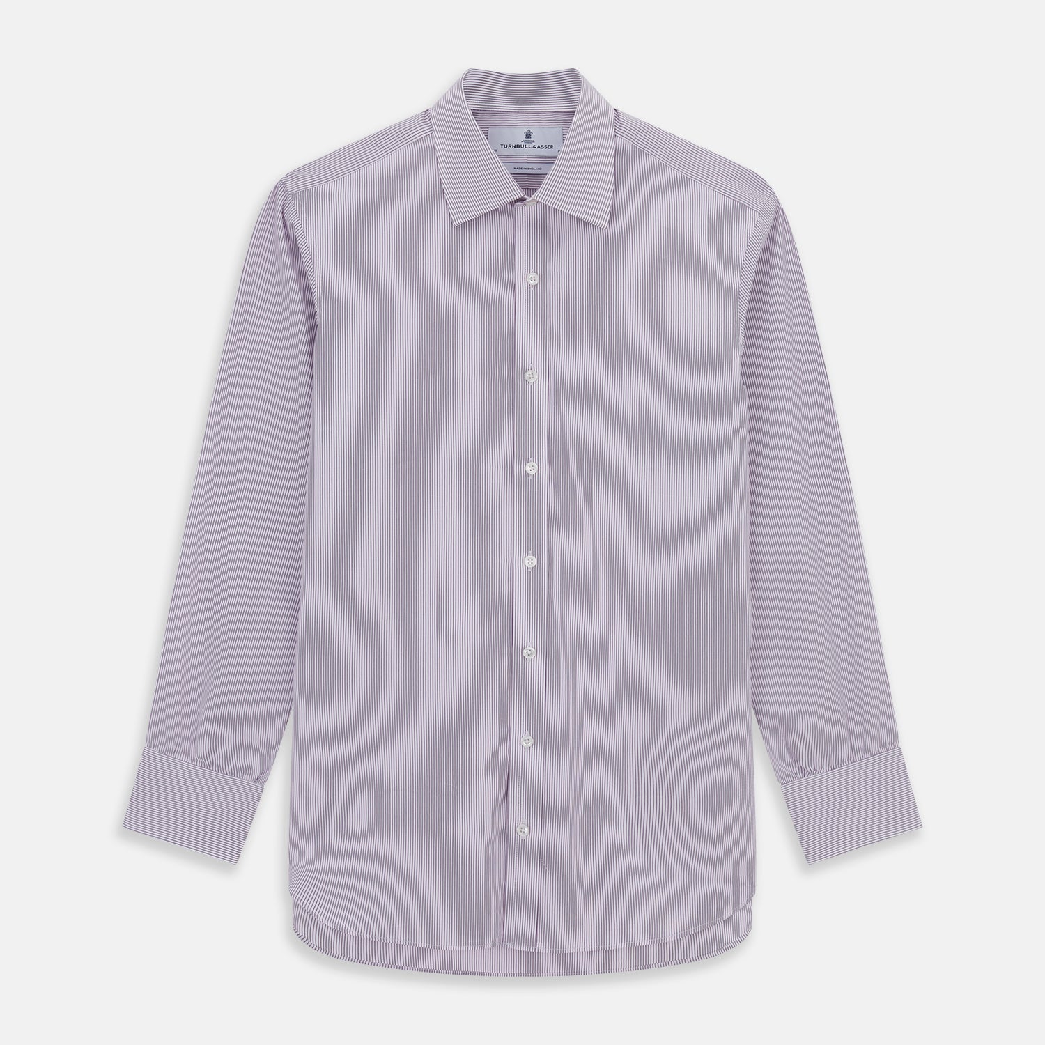 View 1 of product The Purple Pinstripe Mayfair Shirt by Turnbull & Asser is a light purple cotton poplin long-sleeve button-up with white stripes, a pointed collar, white buttons, and cuffed sleeves, shown laid flat on a white background.