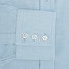 View 3 of product The Turnbull & Asser Blue Cotton Cashmere Mayfair Shirt features long sleeves, a classic collar, buttoned cuffs, and white buttons, shown against a white background.