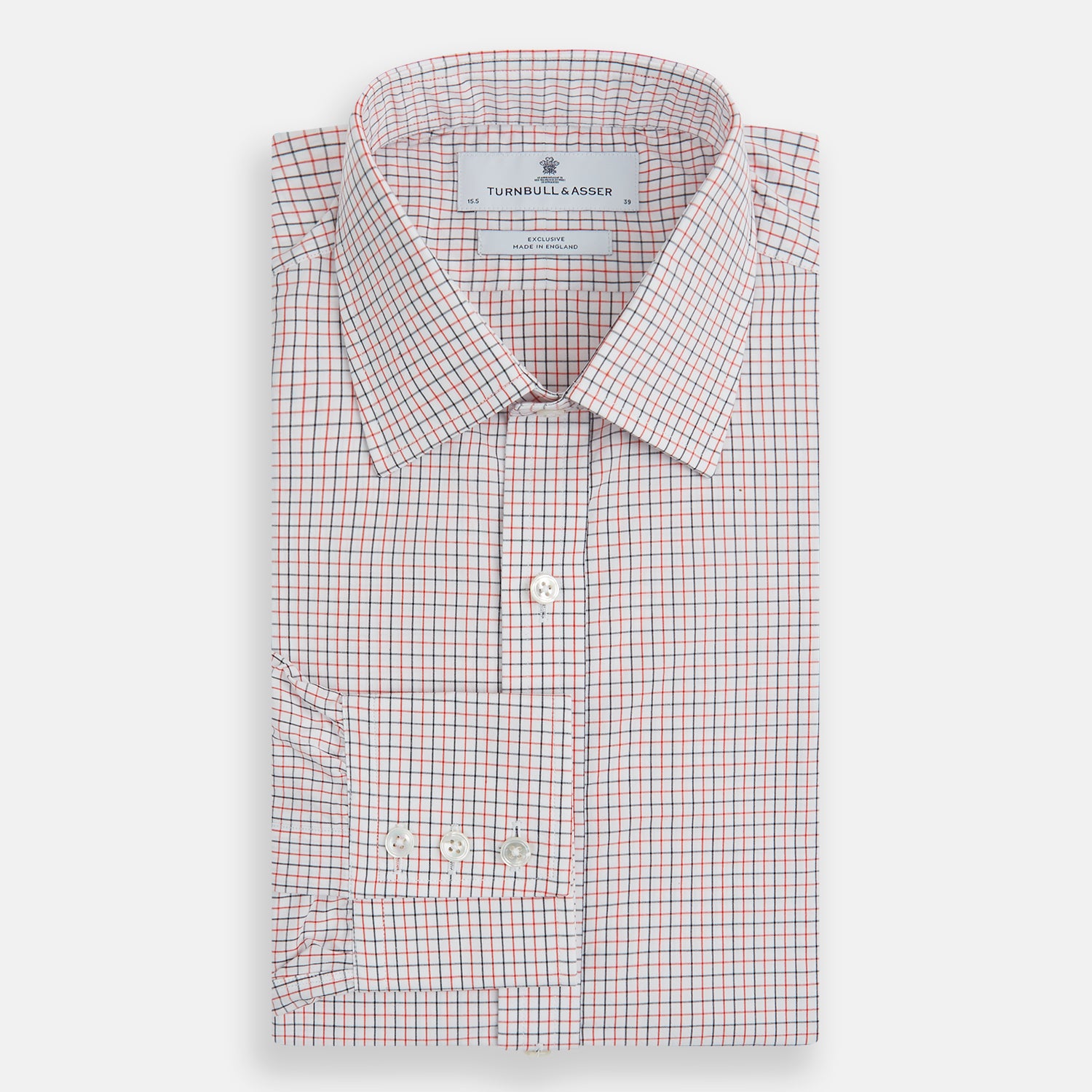 View 4 of product The Turnbull & Asser Red and Navy Graph Check Mayfair Shirt is a long-sleeved organic cotton button-up featuring a collar, buttoned cuffs, and a small red and navy check pattern, shown against a plain white background.