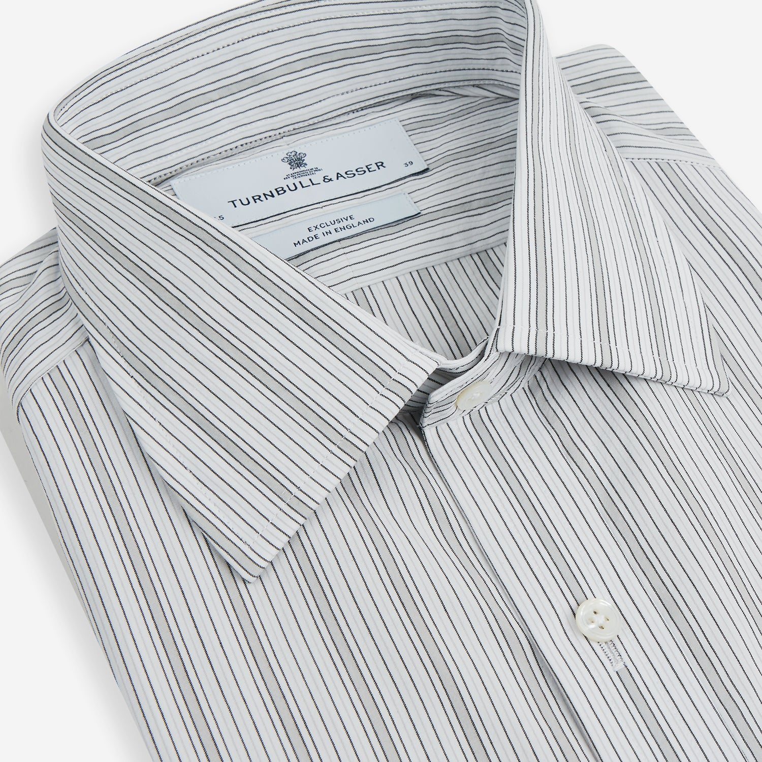 View 2 of product Grey Fine Track Stripe Mayfair Shirt by Turnbull & Asser, featuring breathable cotton with a T&A collar and buttoned cuffs, shown laid flat on a white background.