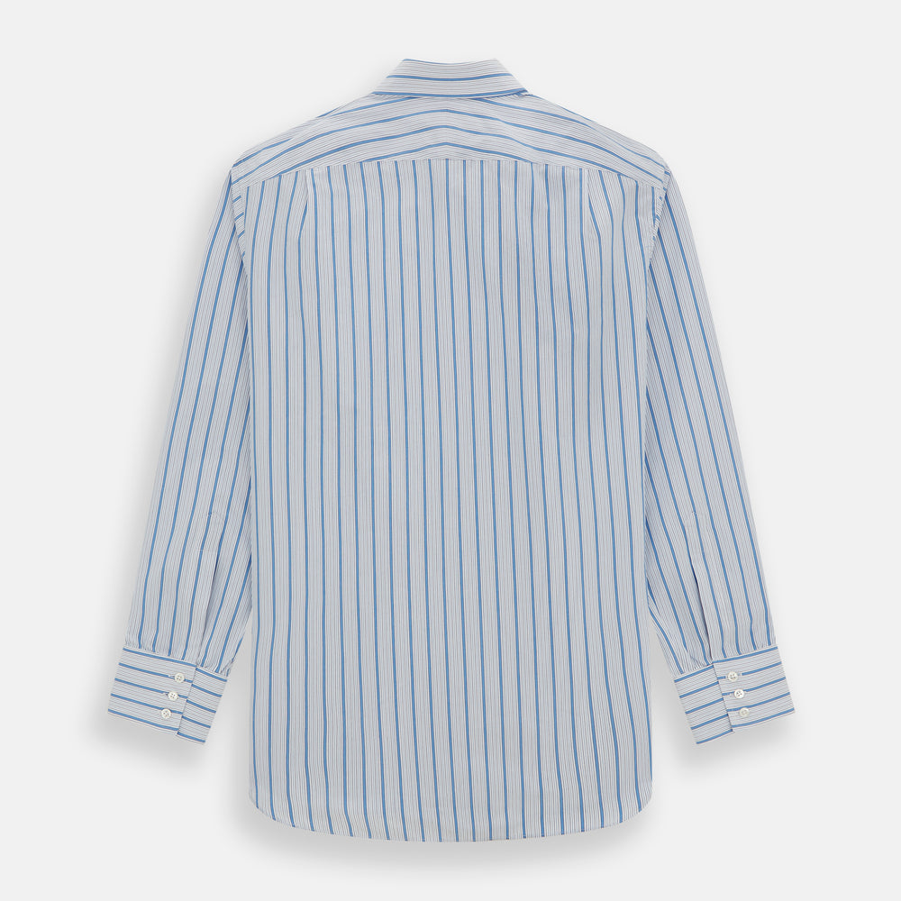 The Turnbull & Asser Blue Multi Track Stripe Mayfair Shirt is a button-up, long-sleeve shirt in white organic cotton with blue vertical stripes, classic collar, and buttoned cuffs.