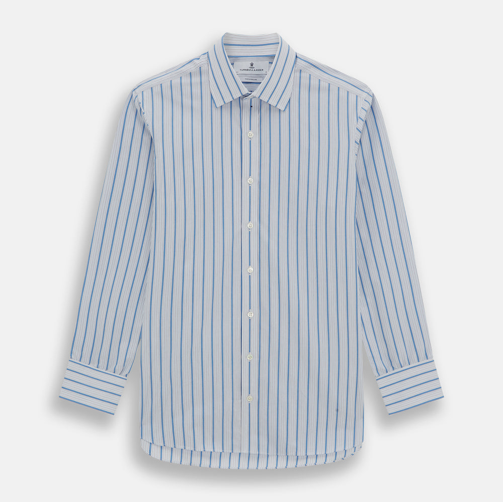 The Turnbull & Asser Blue Multi Track Stripe Mayfair Shirt is a button-up, long-sleeve shirt in white organic cotton with blue vertical stripes, classic collar, and buttoned cuffs.