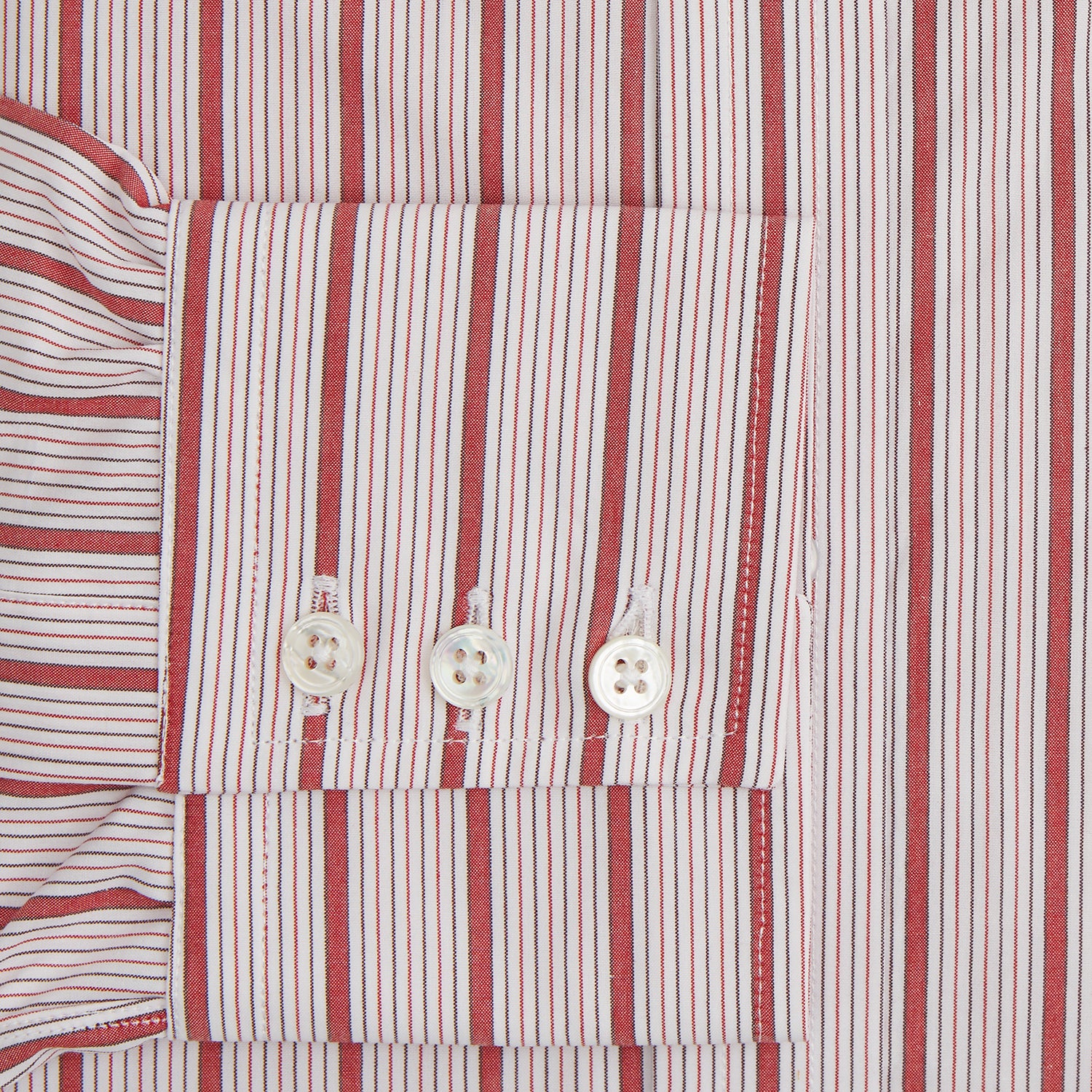 View 3 of product The Red Multi Track Stripe Mayfair Shirt by Turnbull & Asser is a long-sleeved, collared button-up featuring vertical red stripes on white and horizontal red stripes on the cuffs.