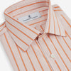 View 2 of product The Orange Graph Overlay Check Mayfair Shirt by Turnbull & Asser is a long-sleeved organic cotton button-up with orange and white stripes, a collar, and wide cuffs—ideal for elevating your wardrobe. Shown against a white background.
