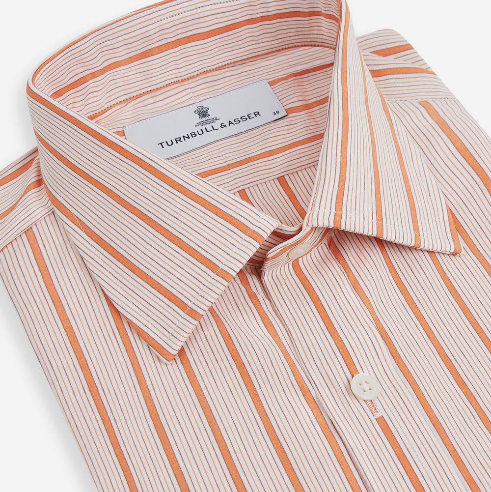 The Orange Graph Overlay Check Mayfair Shirt by Turnbull & Asser is a long-sleeved organic cotton button-up with orange and white stripes, a collar, and wide cuffs—ideal for elevating your wardrobe. Shown against a white background.
