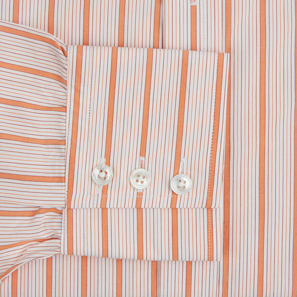 The Orange Graph Overlay Check Mayfair Shirt by Turnbull & Asser is a long-sleeved organic cotton button-up with orange and white stripes, a collar, and wide cuffs—ideal for elevating your wardrobe. Shown against a white background.
