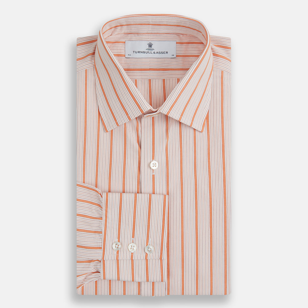 The Orange Graph Overlay Check Mayfair Shirt by Turnbull & Asser is a long-sleeved organic cotton button-up with orange and white stripes, a collar, and wide cuffs—ideal for elevating your wardrobe. Shown against a white background.