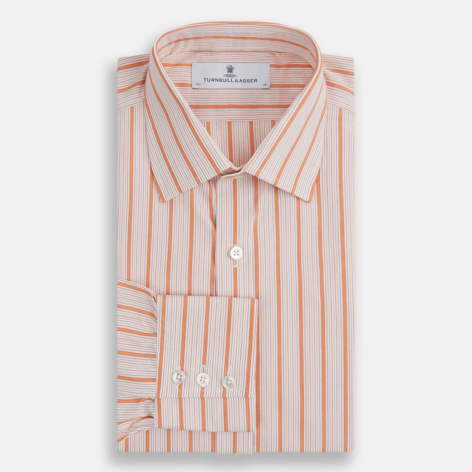 View 4 of product The Orange Graph Overlay Check Mayfair Shirt by Turnbull & Asser is a long-sleeved organic cotton button-up with orange and white stripes, a collar, and wide cuffs—ideal for elevating your wardrobe. Shown against a white background.