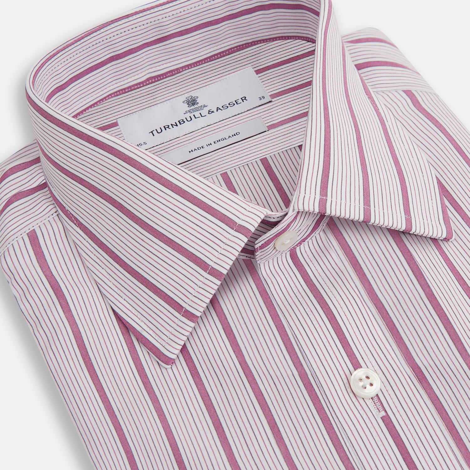 View 2 of product A long-sleeved, collared Turnbull & Asser Purple Multi Track Stripe Mayfair Shirt with buttons, showcasing vertical purple multi-colored stripes, neatly displayed against a plain background.