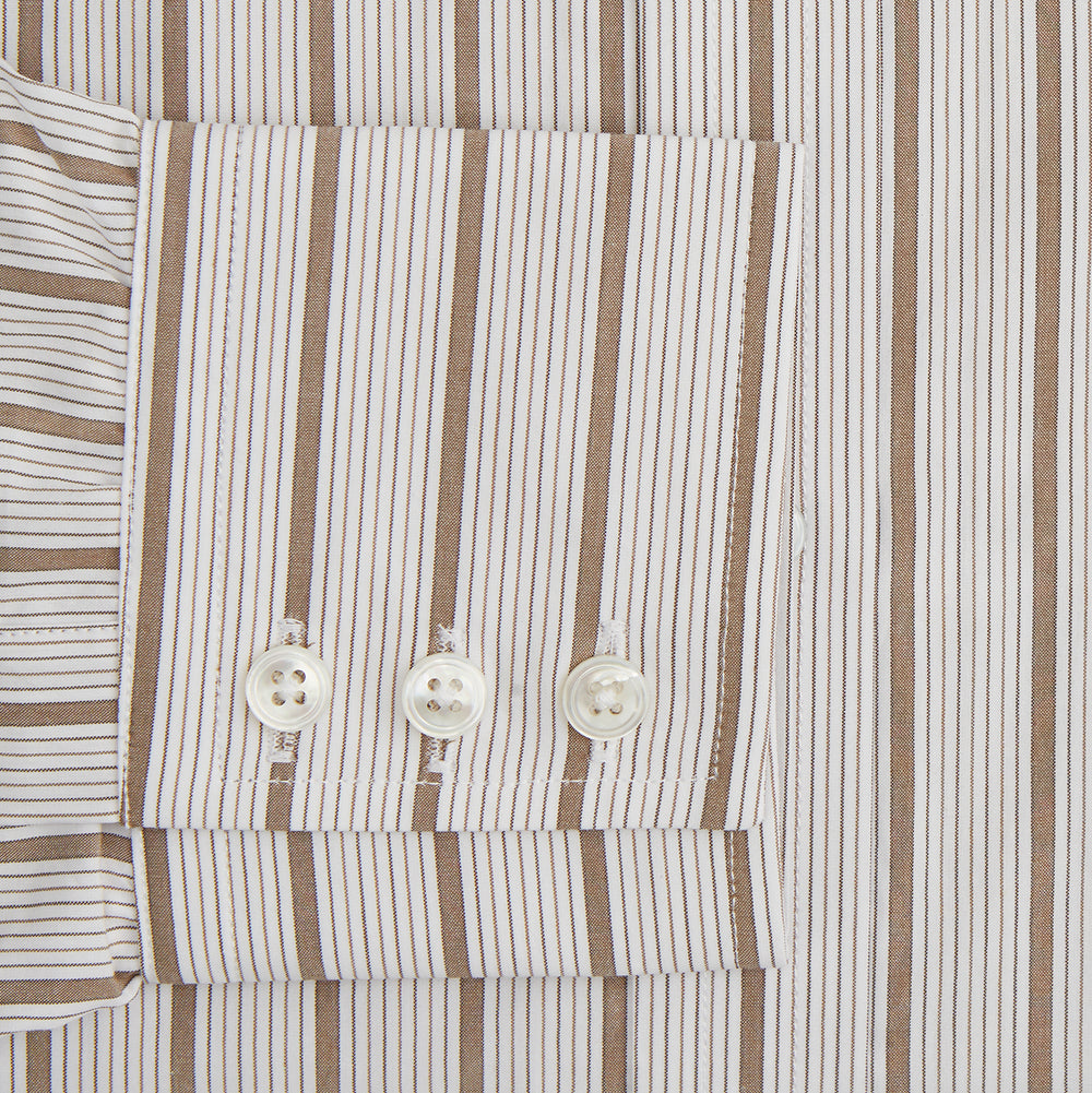 The Brown Multi Track Stripe Mayfair Shirt by Turnbull & Asser is a long-sleeved, collared, button-up in organic cotton with vertical brown and white stripes, classic fit, cuffs, and timeless style—shown on a plain white background.