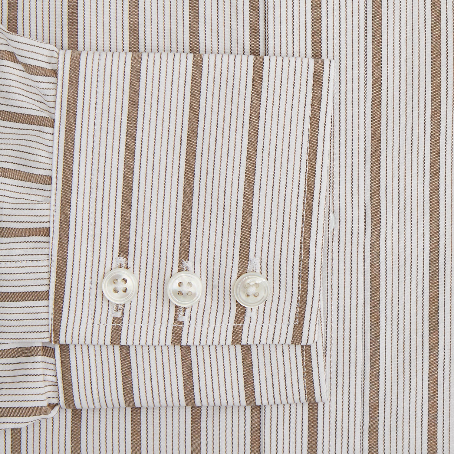 View 3 of product The Brown Multi Track Stripe Mayfair Shirt by Turnbull & Asser is a long-sleeved, collared, button-up in organic cotton with vertical brown and white stripes, classic fit, cuffs, and timeless style—shown on a plain white background.
