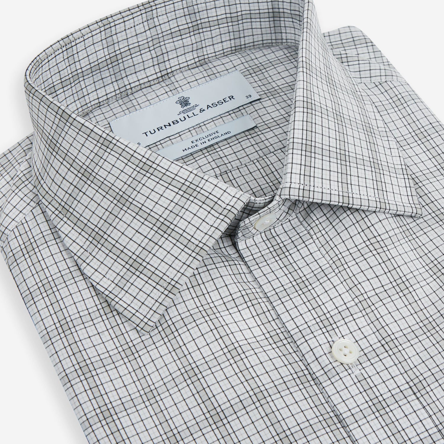 View 2 of product The Turnbull & Asser Grey Fine Multi Graph Check Mayfair Shirt features a breathable cotton fabric, classic T&A collar, white buttons, and a subtle plaid pattern, displayed on a white background.