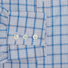 View 3 of product The Turnbull & Asser Blue Graph Overlay Check Mayfair Shirt features long sleeves, a spread collar, buttoned cuffs, and a blue and white plaid pattern, shown against a plain white background.