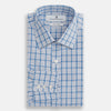 View 4 of product The Turnbull & Asser Blue Graph Overlay Check Mayfair Shirt features long sleeves, a spread collar, buttoned cuffs, and a blue and white plaid pattern, shown against a plain white background.