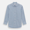 View 1 of product The Turnbull & Asser Blue Graph Overlay Check Mayfair Shirt features long sleeves, a spread collar, buttoned cuffs, and a blue and white plaid pattern, shown against a plain white background.