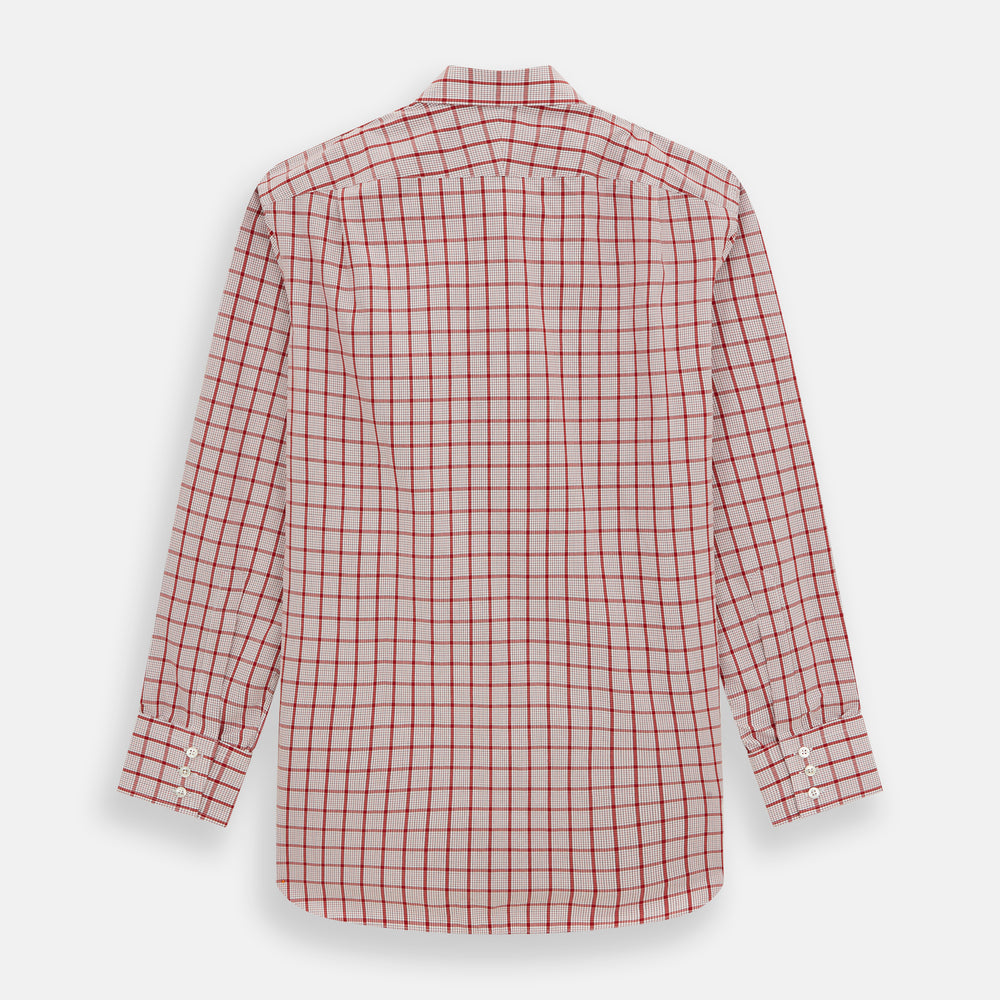 The Red Graph Overlay Check Mayfair Shirt by Turnbull & Asser is a long-sleeved, button-up shirt with a white base and red check pattern, featuring a collar and buttoned cuffs. Displayed on a plain white background.