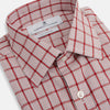 View 2 of product The Red Graph Overlay Check Mayfair Shirt by Turnbull & Asser is a long-sleeved, button-up shirt with a white base and red check pattern, featuring a collar and buttoned cuffs. Displayed on a plain white background.