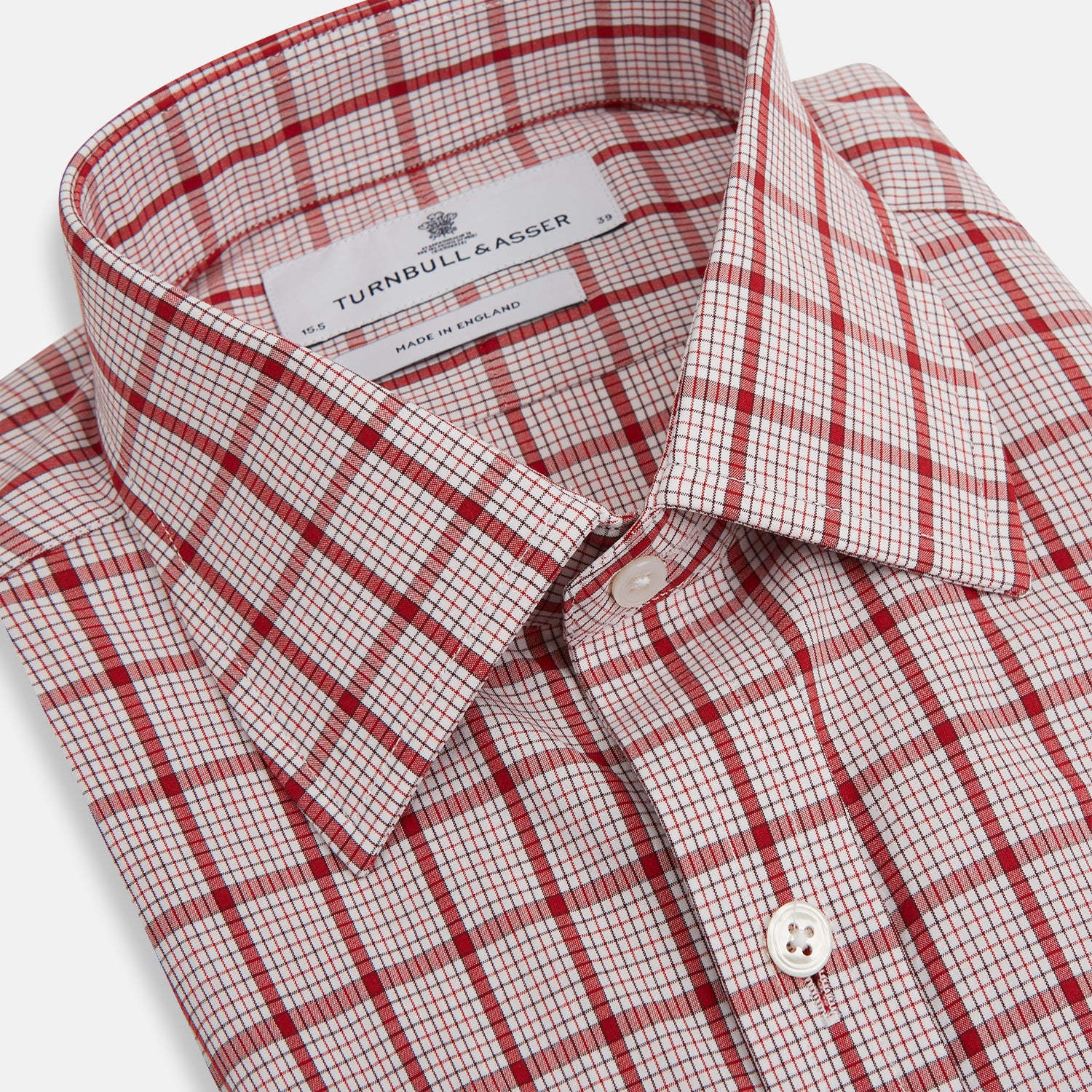 View 2 of product The Red Graph Overlay Check Mayfair Shirt by Turnbull & Asser is a long-sleeved, button-up shirt with a white base and red check pattern, featuring a collar and buttoned cuffs. Displayed on a plain white background.
