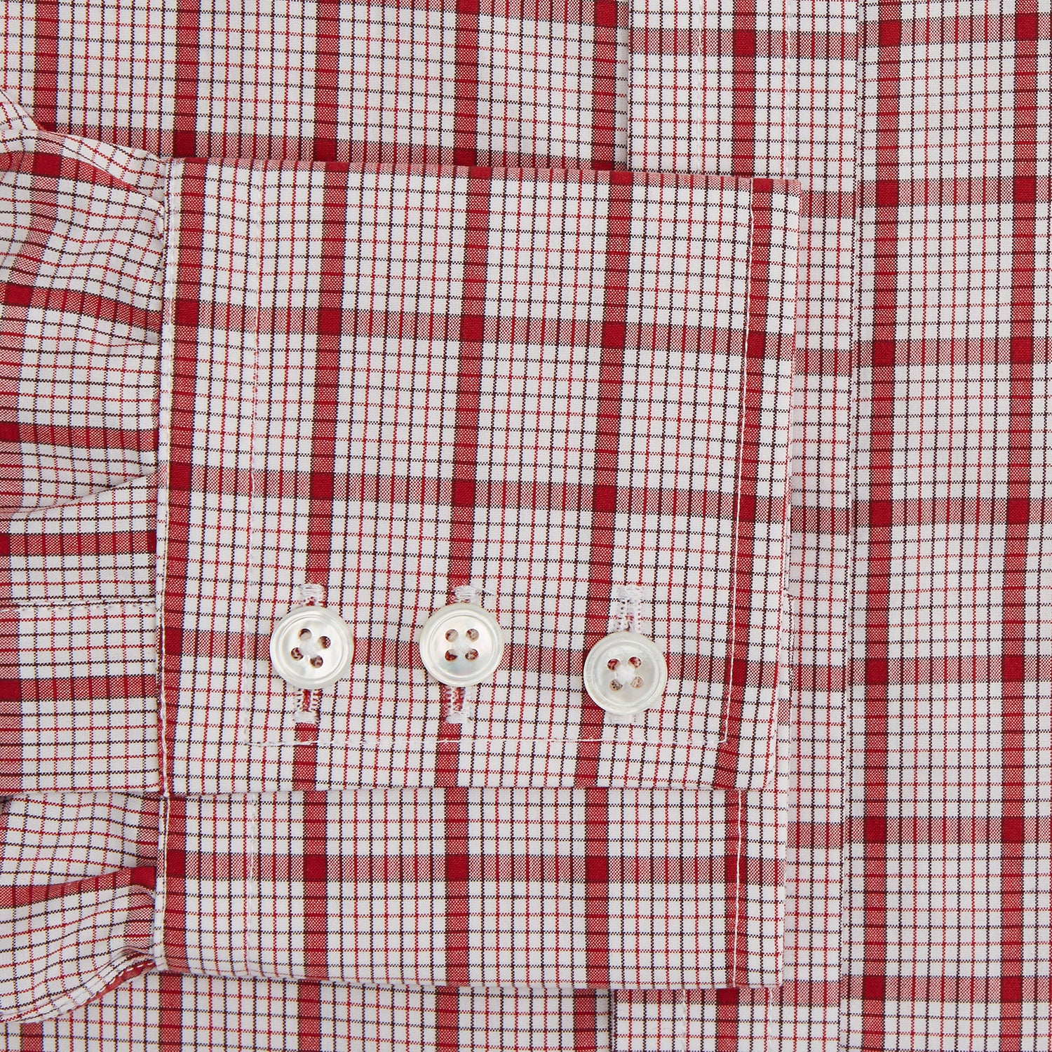 View 3 of product The Red Graph Overlay Check Mayfair Shirt by Turnbull & Asser is a long-sleeved, button-up shirt with a white base and red check pattern, featuring a collar and buttoned cuffs. Displayed on a plain white background.