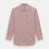 View 1 of product The Red Graph Overlay Check Mayfair Shirt by Turnbull & Asser is a long-sleeved, button-up shirt with a white base and red check pattern, featuring a collar and buttoned cuffs. Displayed on a plain white background.