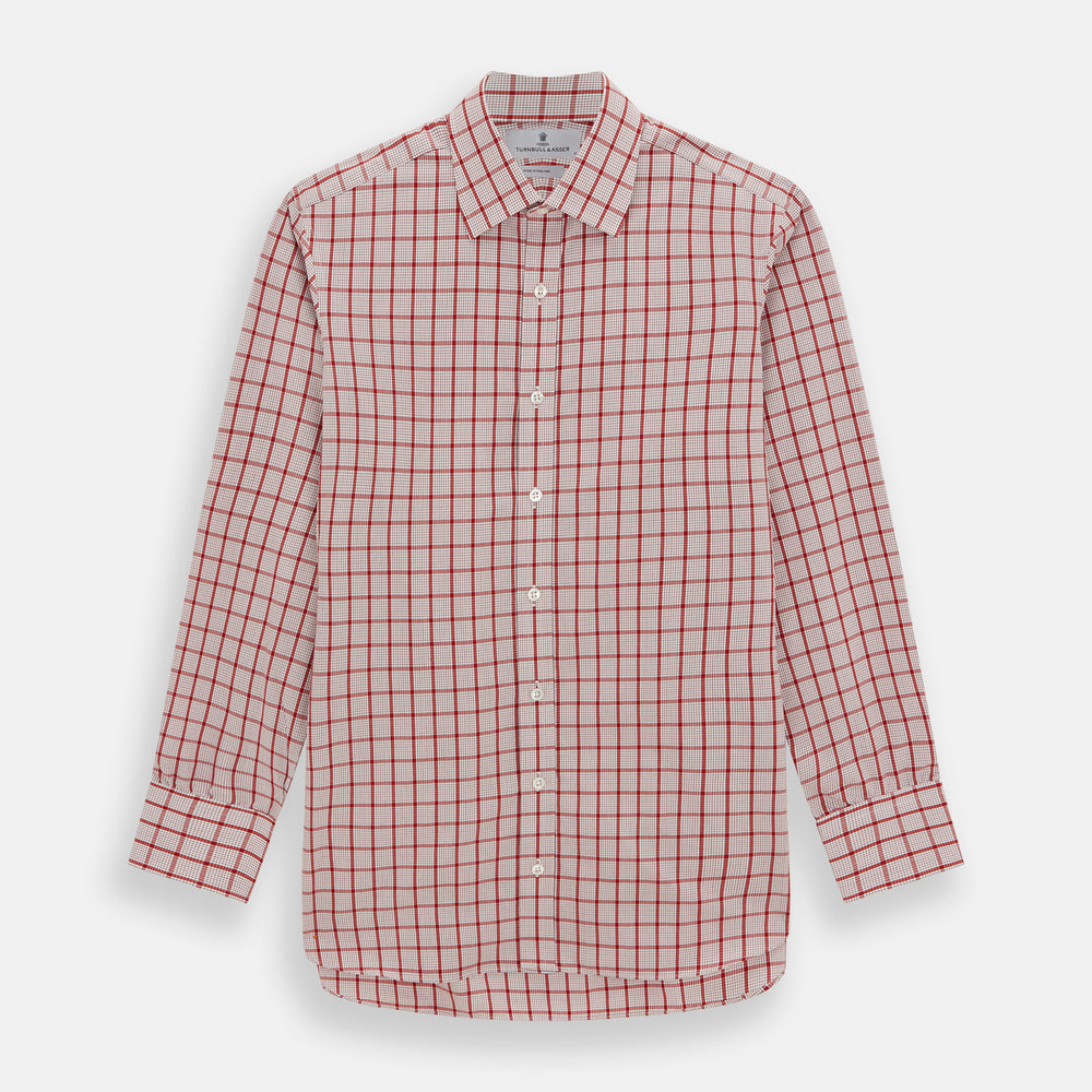The Red Graph Overlay Check Mayfair Shirt by Turnbull & Asser is a long-sleeved, button-up shirt with a white base and red check pattern, featuring a collar and buttoned cuffs. Displayed on a plain white background.
