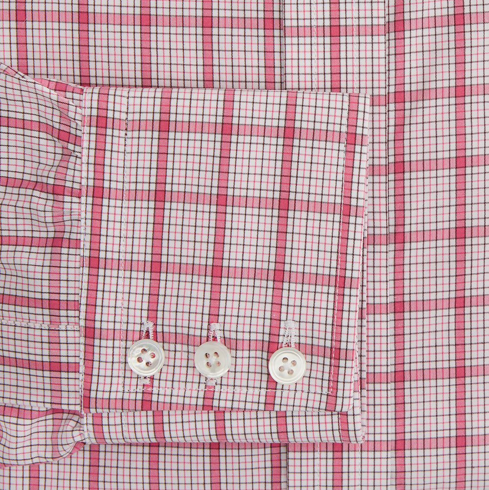 The Turnbull & Asser Pink Graph Overlay Check Mayfair Shirt features a classic collar, long sleeves, and a pink check pattern. Crafted from organic cotton, it is showcased against a plain white background.