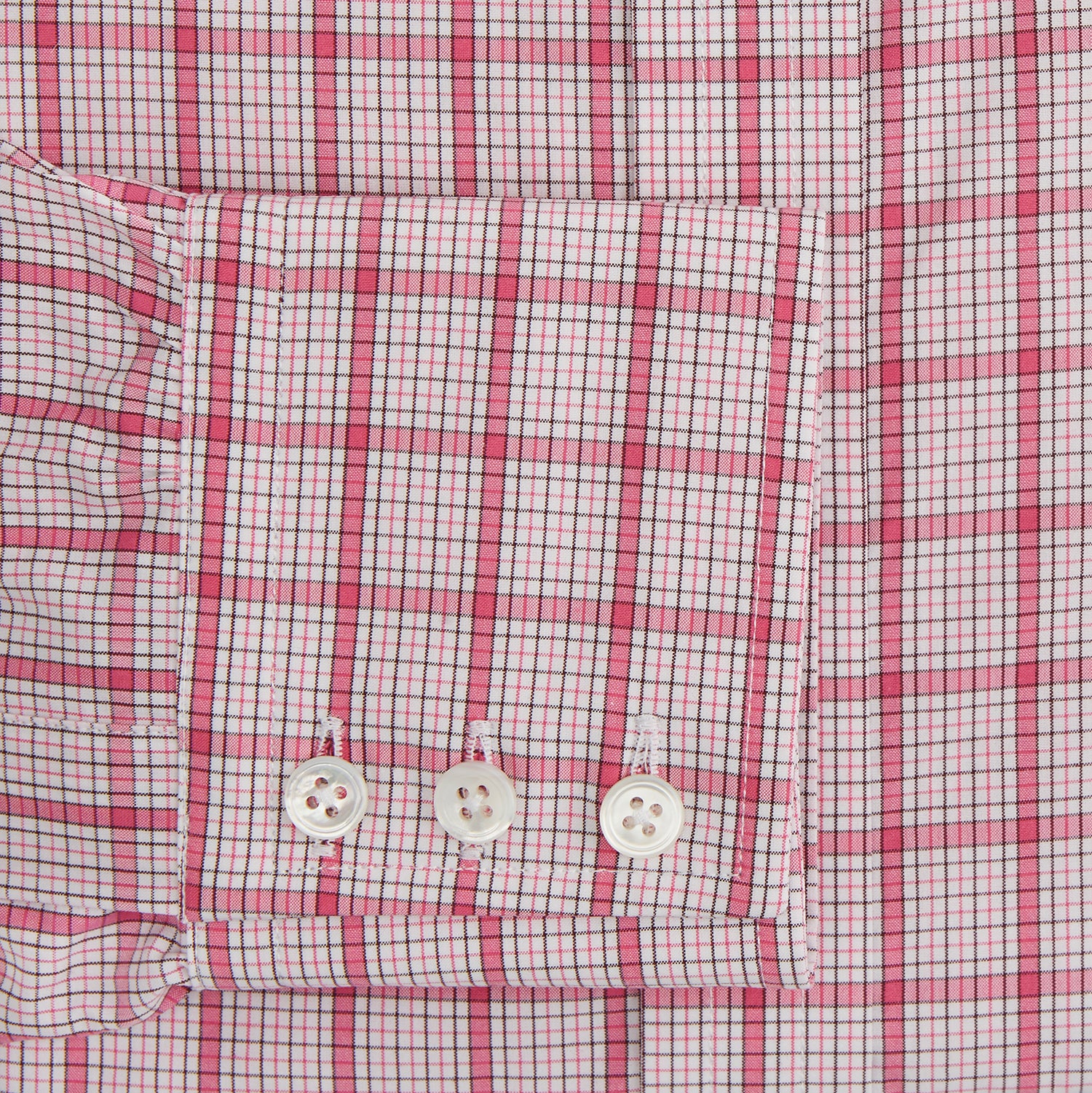 View 3 of product The Turnbull & Asser Pink Graph Overlay Check Mayfair Shirt features a classic collar, long sleeves, and a pink check pattern. Crafted from organic cotton, it is showcased against a plain white background.