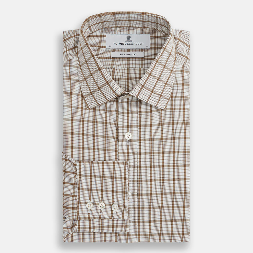 The Turnbull & Asser Brown Graph Overlay Check Mayfair Shirt, an organic cotton long-sleeve button-up with collar and cuffed sleeves, features a beige and white check pattern and is shown laid flat on a white background.