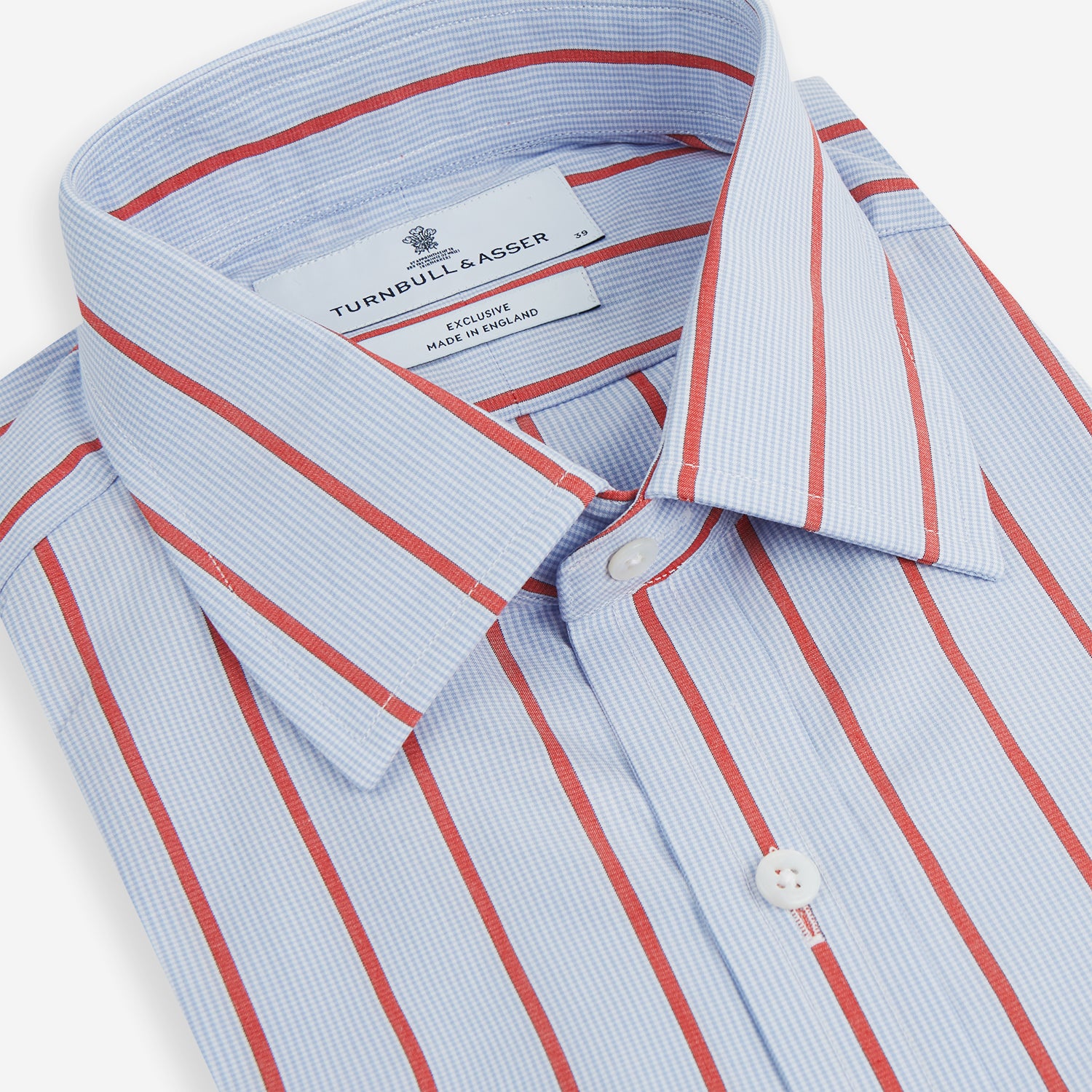 View 2 of product The Red Track Stripe Mayfair Shirt by Turnbull & Asser is made from organic cotton, features a T&A collar, and displays red vertical stripes on light blue, shown against a plain white background.