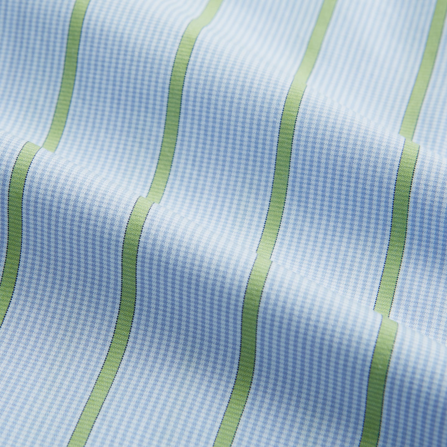 View 5 of product The Light Green and Blue Stripe Mayfair Shirt by Turnbull & Asser, crafted from organic cotton with vertical stripes and a classic T&A collar, is shown with buttoned cuffs against a plain white background.