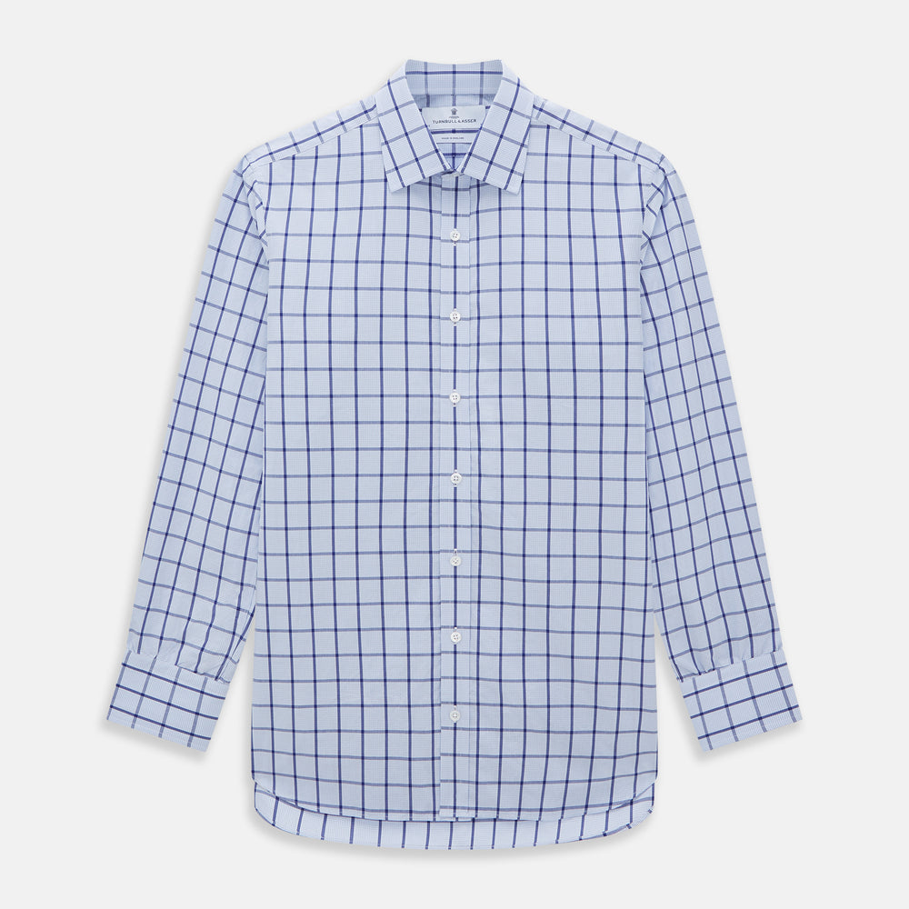 The Turnbull & Asser Navy Blue Windowpane Check Mayfair Shirt is a long-sleeved, organic cotton, button-up dress shirt with a classic collar and buttoned cuffs—white fabric with navy windowpane checks, ideal for any wardrobe capsule.