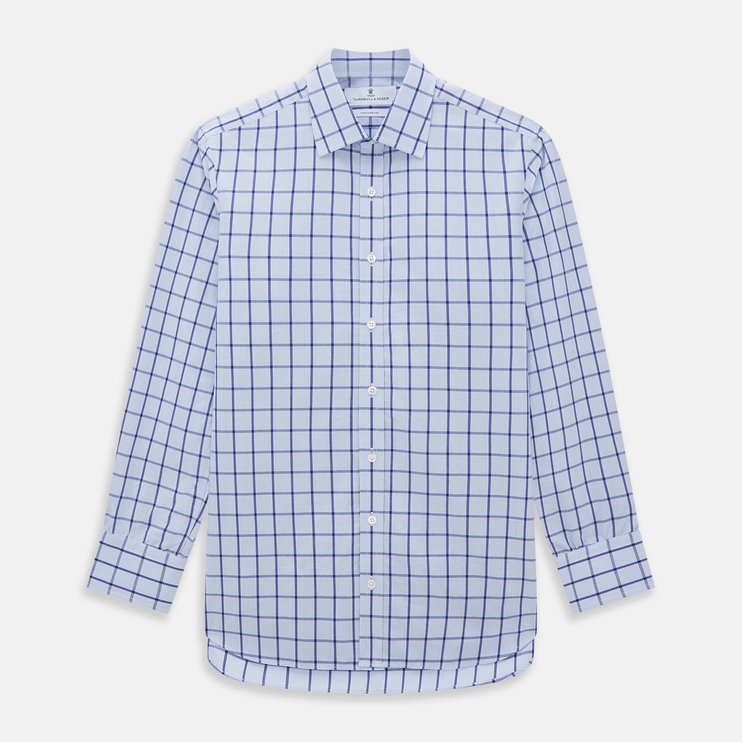 View 1 of product The Turnbull & Asser Navy Blue Windowpane Check Mayfair Shirt is a long-sleeved, organic cotton, button-up dress shirt with a classic collar and buttoned cuffs—white fabric with navy windowpane checks, ideal for any wardrobe capsule.