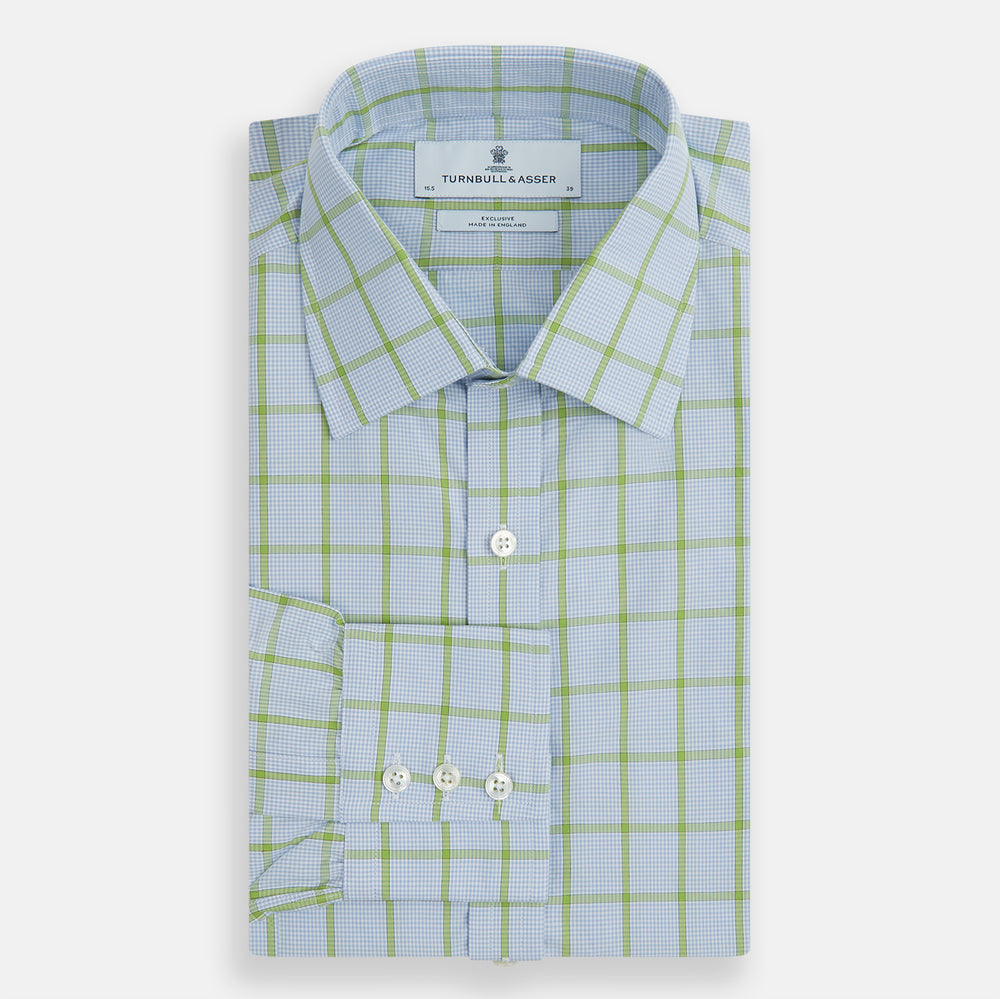 The Turnbull & Asser Light Green Windowpane Check Mayfair Shirt, crafted from organic cotton with a classic collar and buttoned cuffs, is displayed on a plain white background.