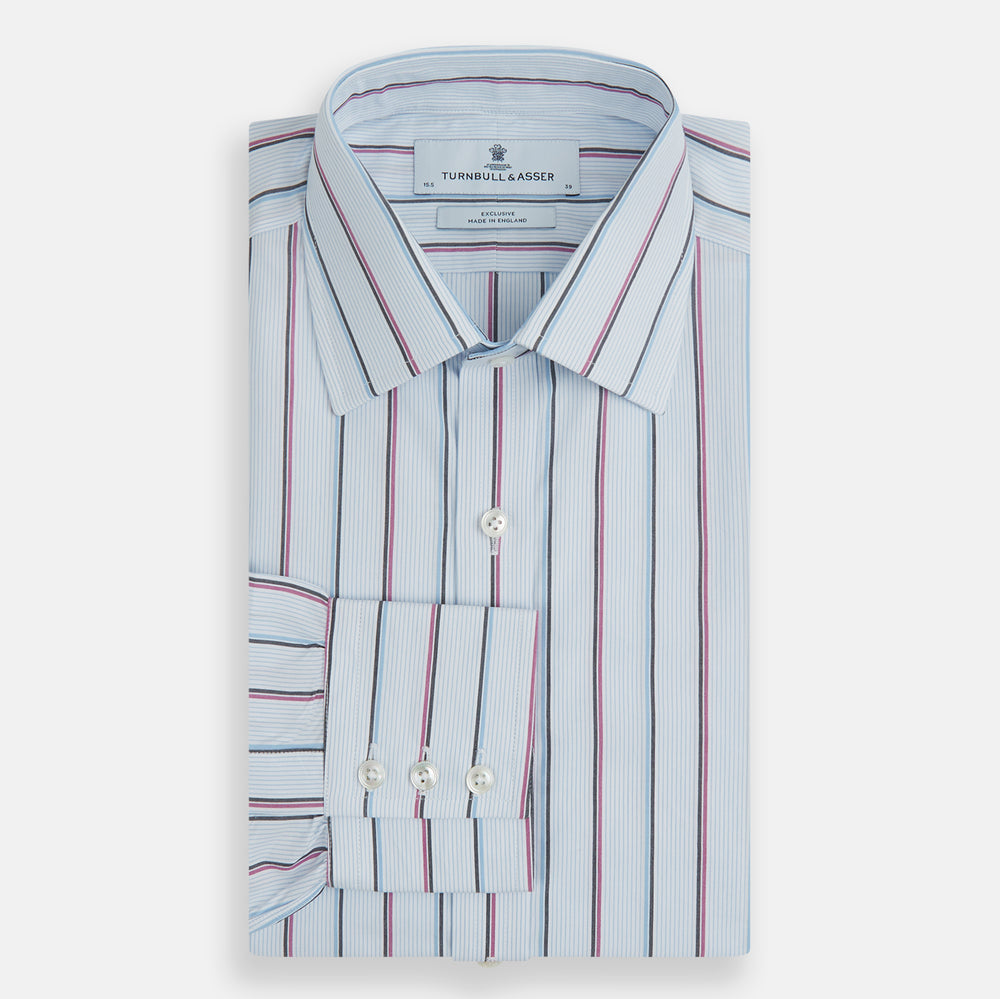 The Blue and Pink Shadow Stripe Mayfair Shirt by Turnbull & Asser features a T&A collar, long sleeves, buttoned cuffs, and a relaxed fit. Made from organic cotton with blue and pink shadow stripes for effortless style.
