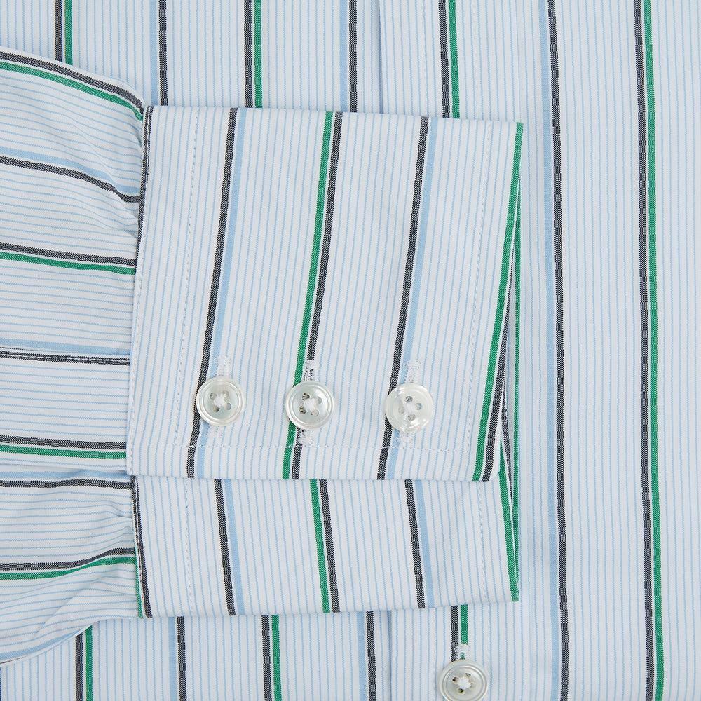 The Blue and Green Shadow Stripe Mayfair Shirt by Turnbull & Asser is a long-sleeved, organic cotton button-up with a T&A collar, buttoned cuffs, and blue and green vertical stripes on white. Features a slightly rounded hem.