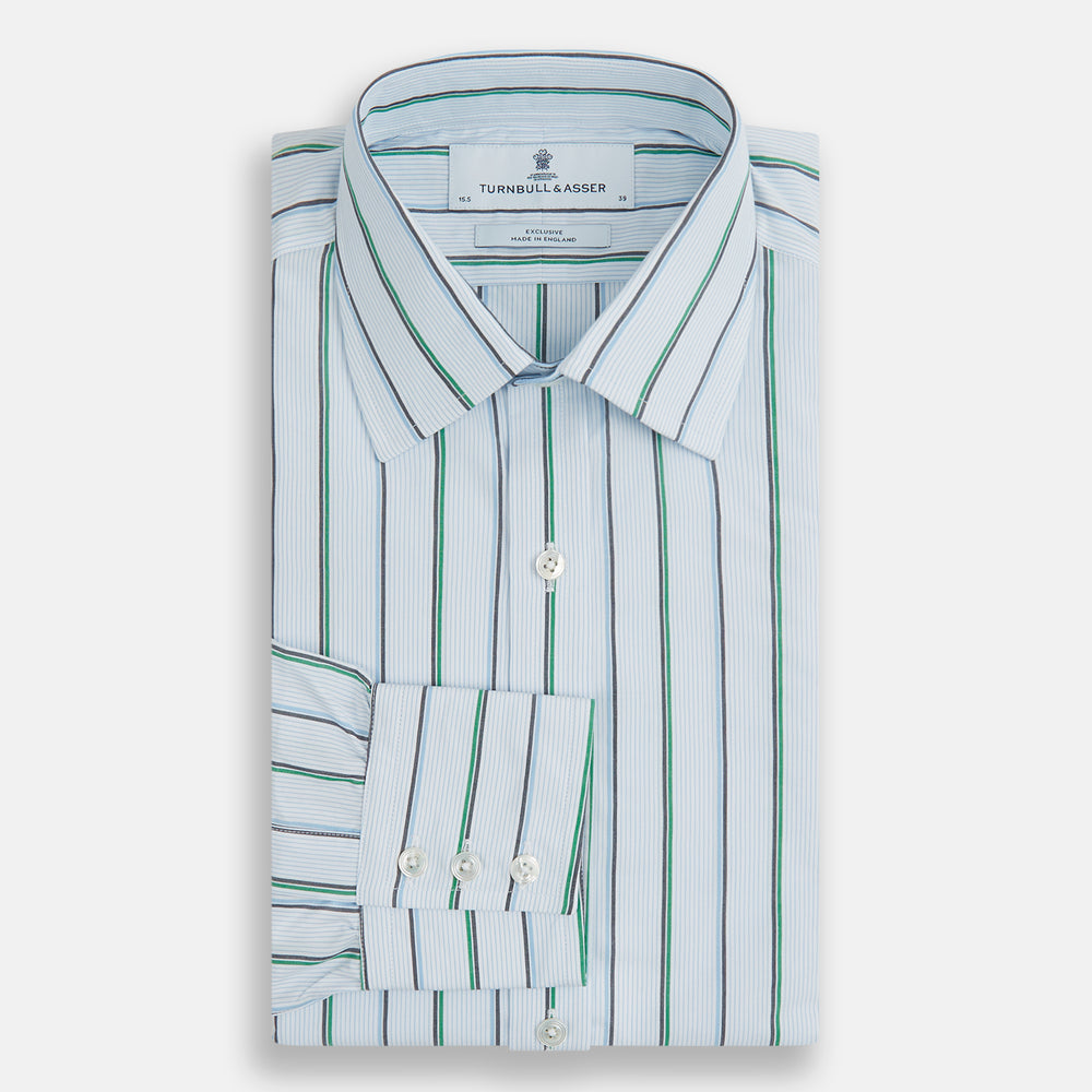 The Blue and Green Shadow Stripe Mayfair Shirt by Turnbull & Asser is a long-sleeved, organic cotton button-up with a T&A collar, buttoned cuffs, and blue and green vertical stripes on white. Features a slightly rounded hem.