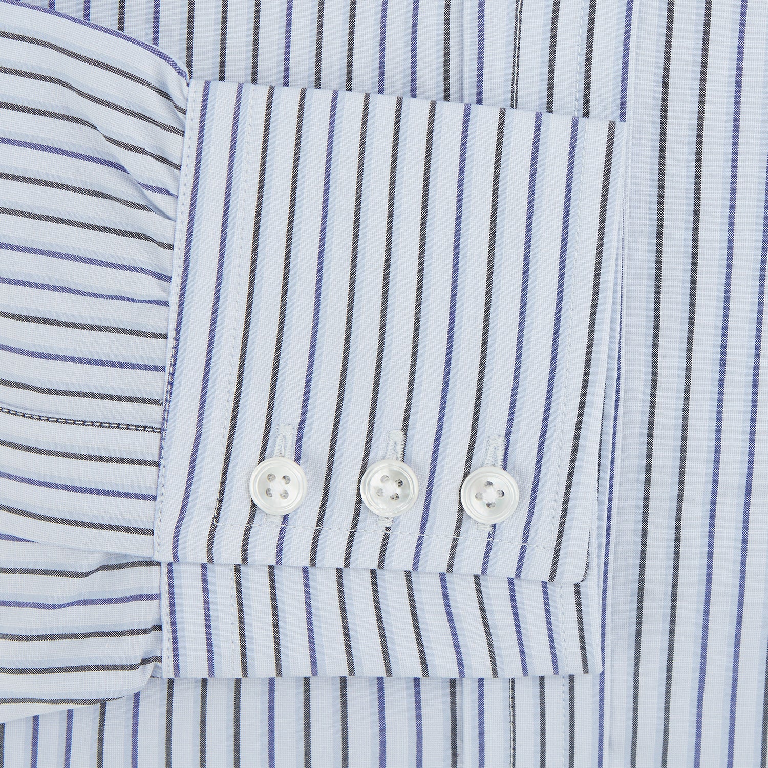 View 3 of product The Blue Shadow Pinstripe Mayfair Shirt by Turnbull & Asser is a long-sleeve, organic cotton dress shirt with light blue and white vertical stripes, a collar, and button-down front, shown against a white background.