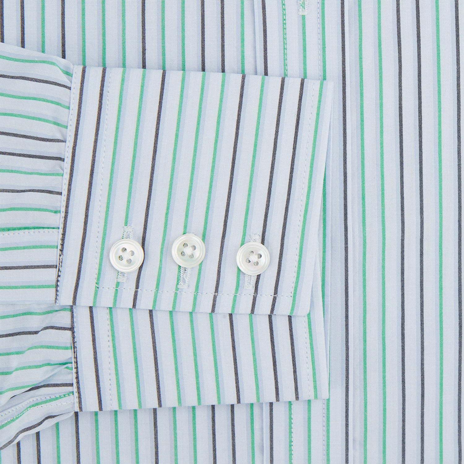 View 3 of product The Green and Blue Shadow Pinstripe Mayfair Shirt by Turnbull & Asser features long sleeves, a pointed collar, white buttons, and subtle green and blue pinstripes—a refined choice for any wardrobe capsule.