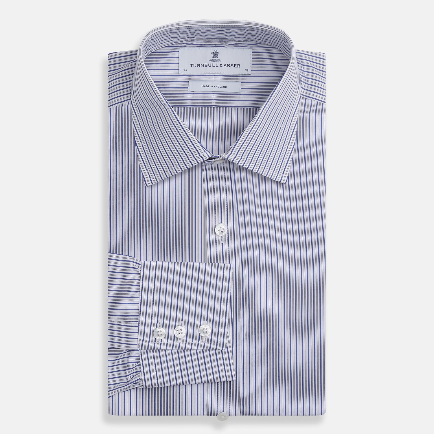 View 4 of product The Dark Blue Track Stripe Mayfair Shirt by Turnbull & Asser is a long-sleeve, button-up Egyptian cotton shirt with a classic collar and thin blue and white stripes, laid flat on a white background.