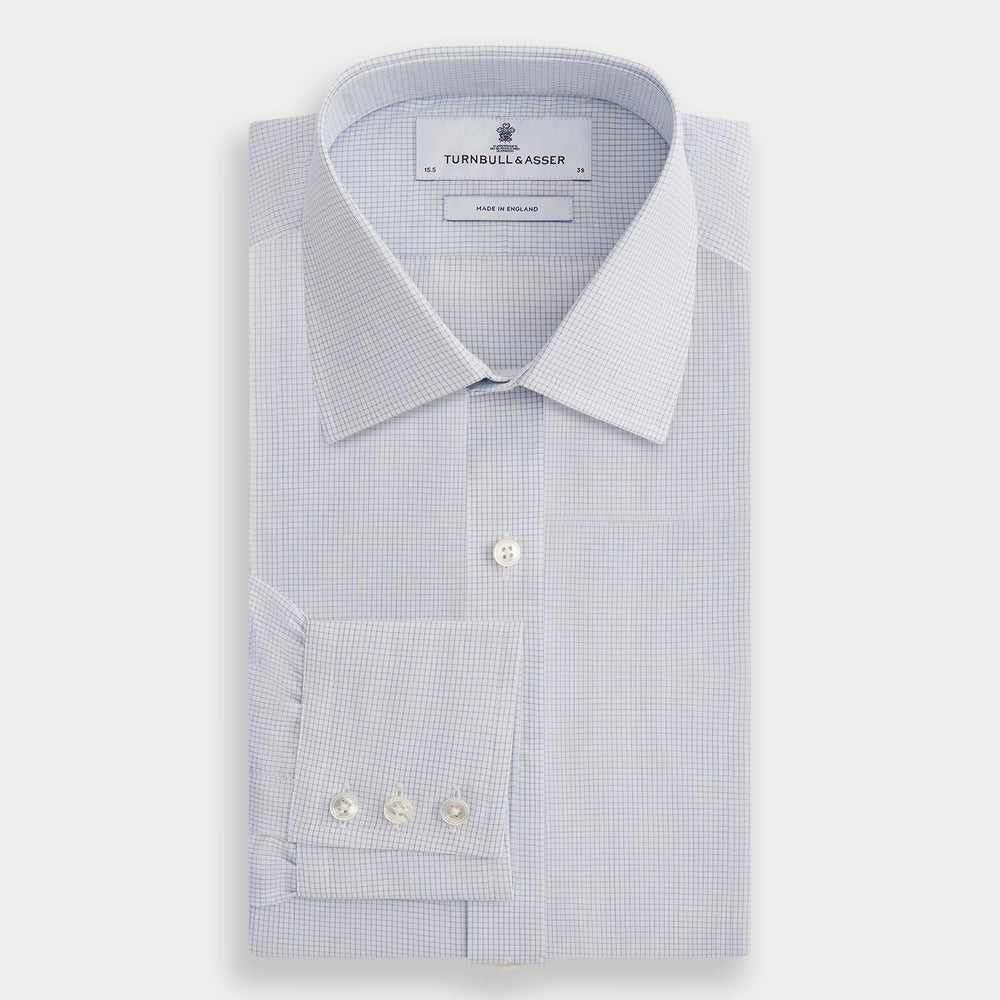The Turnbull & Asser Blue Fine Graph Check Mayfair Shirt, made from breathable cotton, features long sleeves, a T&A collar, white buttons, and buttoned cuffs, displayed flat on a white background.
