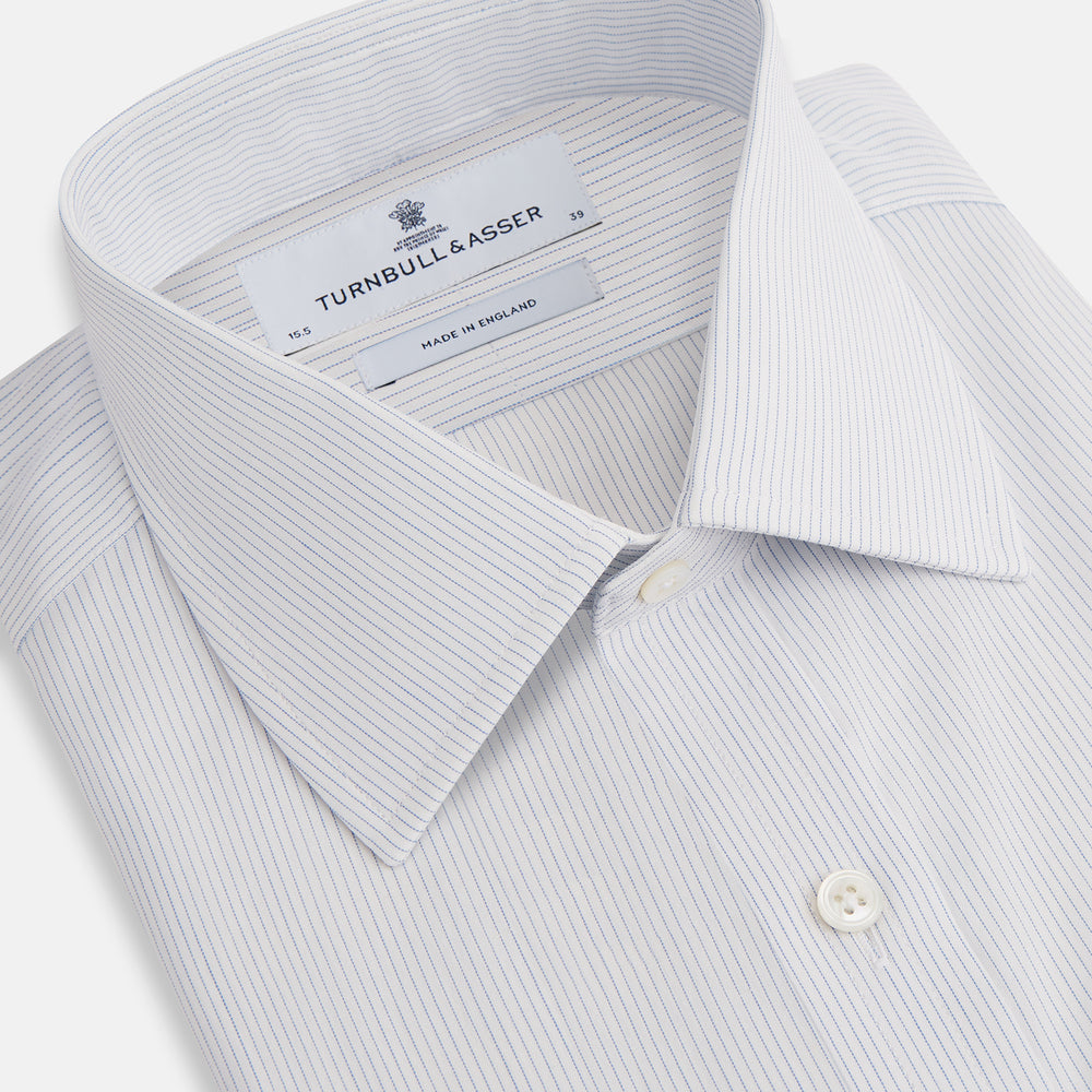 The Blue Pencil Stripe Mayfair Shirt by Turnbull & Asser features light blue stripes, long sleeves, a classic T&A collar, and buttoned cuffs, displayed on a plain white background.